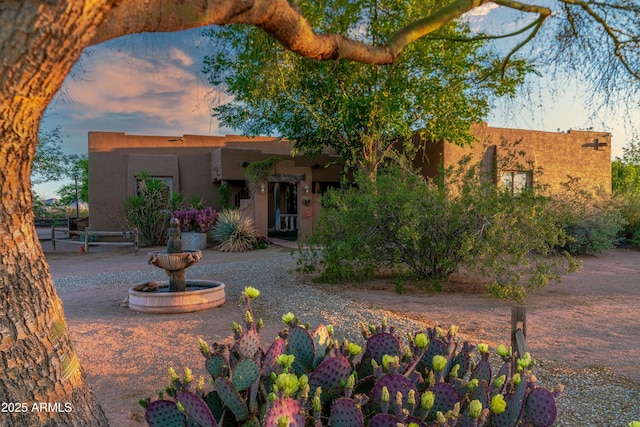 21909 W Beacon Ln, Wittmann, AZ 85361 - pueblo-style home with stucco siding