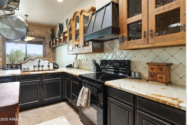 21909 W Beacon Ln, Wittmann, AZ 85361 - kitchen with a sink, electric range, backsplash, and premium range hood
