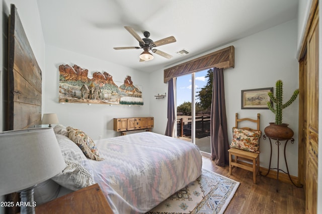 21909 W Beacon Ln, Wittmann, AZ 85361 - bedroom with access to outside, a ceiling fan, baseboards, wood finished floors, and visible vents