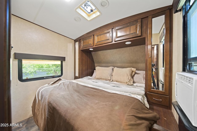 21909 W Beacon Ln, Wittmann, AZ 85361 - bedroom with dark wood-style flooring and vaulted ceiling