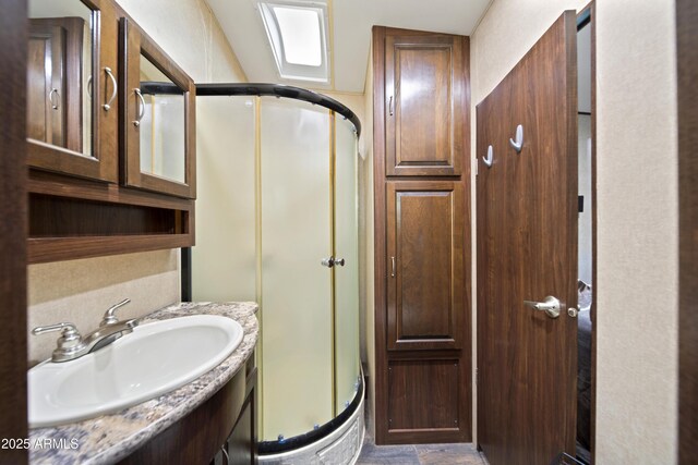 21909 W Beacon Ln, Wittmann, AZ 85361 - bathroom featuring vanity and a stall shower