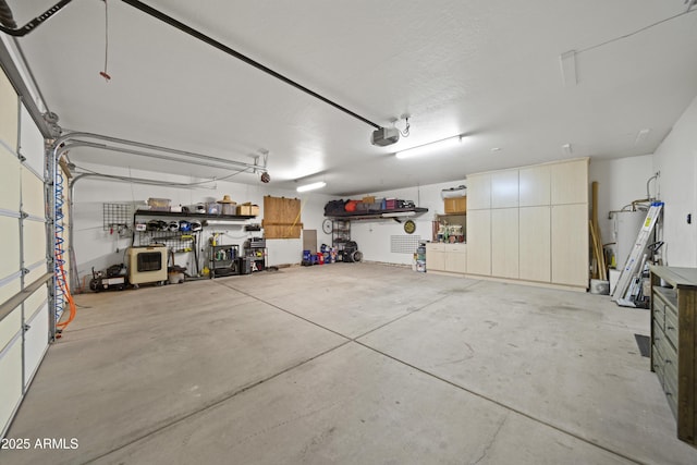 21909 W Beacon Ln, Wittmann, AZ 85361 - garage featuring a garage door opener and water heater