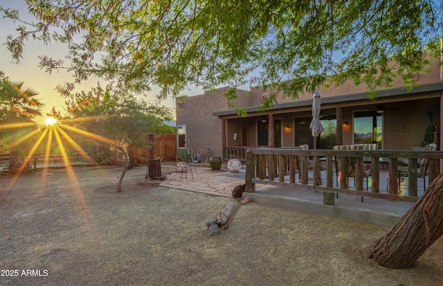21909 W Beacon Ln, Wittmann, AZ 85361 - back of property featuring a patio, fence, a ceiling fan, and stucco siding