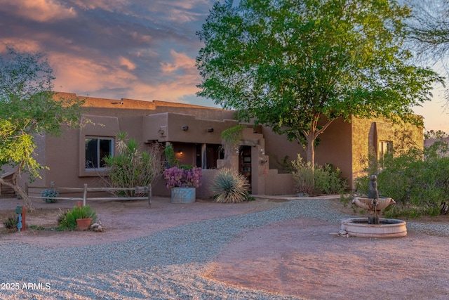 21909 W Beacon Ln, Wittmann, AZ 85361 - pueblo revival-style home featuring stucco siding