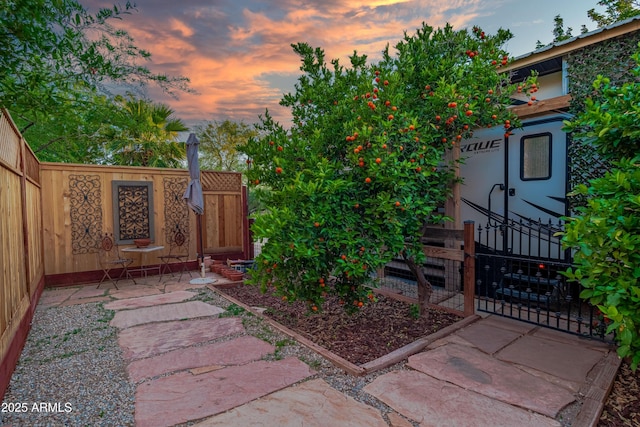 21909 W Beacon Ln, Wittmann, AZ 85361 - yard at dusk with fence private yard and a patio area