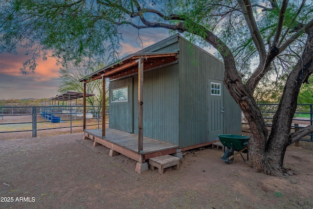 21909 W Beacon Ln, Wittmann, AZ 85361 - outdoor structure at dusk with fence and an outbuilding