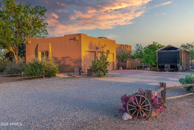 21909 W Beacon Ln, Wittmann, AZ 85361 - view of front of property featuring a garage, fence, and concrete driveway