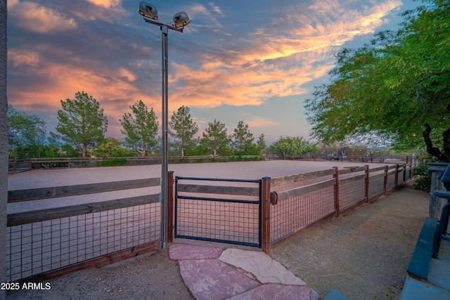 21909 W Beacon Ln, Wittmann, AZ 85361 - gate at dusk with an enclosed area