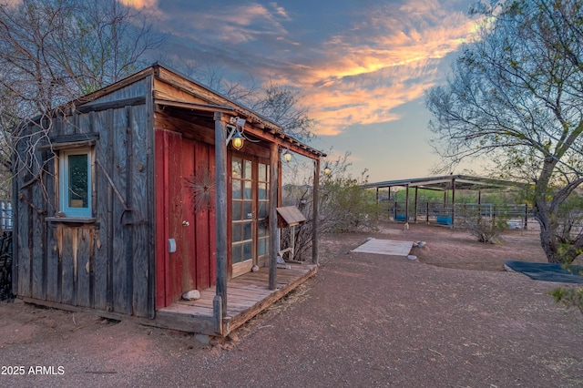 21909 W Beacon Ln, Wittmann, AZ 85361 - outdoor structure at dusk featuring an outdoor structure