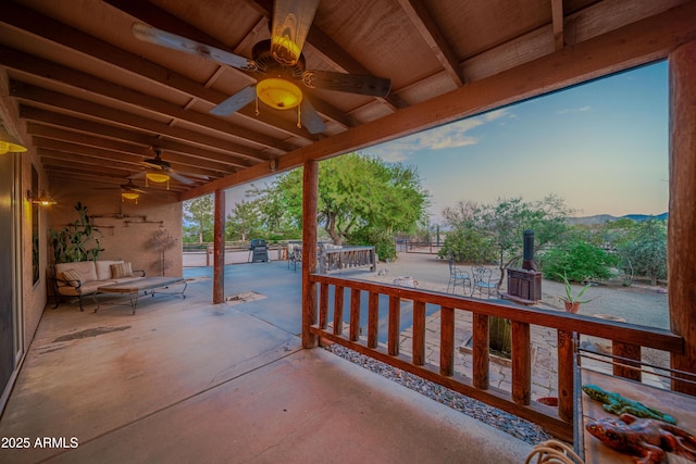 21909 W Beacon Ln, Wittmann, AZ 85361 - patio terrace at dusk with ceiling fan