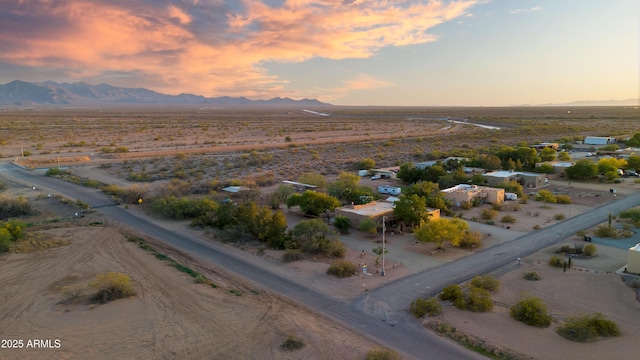 21909 W Beacon Ln, Wittmann, AZ 85361 - aerial view at dusk featuring a mountain view and a rural view
