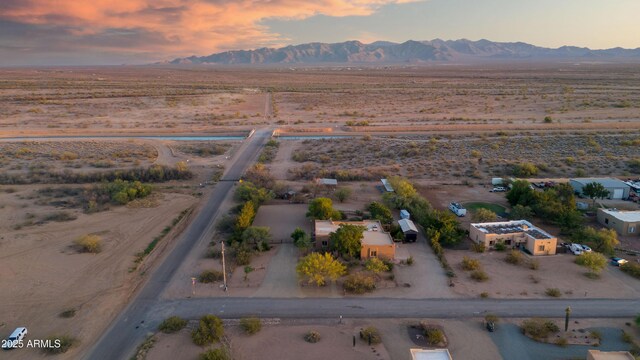 21909 W Beacon Ln, Wittmann, AZ 85361 - aerial view at dusk featuring a rural view, a mountain view, and a desert view