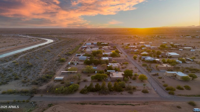 21909 W Beacon Ln, Wittmann, AZ 85361 - aerial view at dusk featuring a desert view, a mountain view, and a residential view