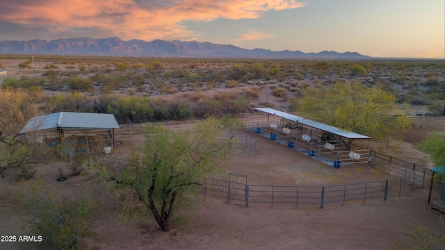 21909 W Beacon Ln, Wittmann, AZ 85361 - aerial view at dusk featuring a mountain view and a rural view