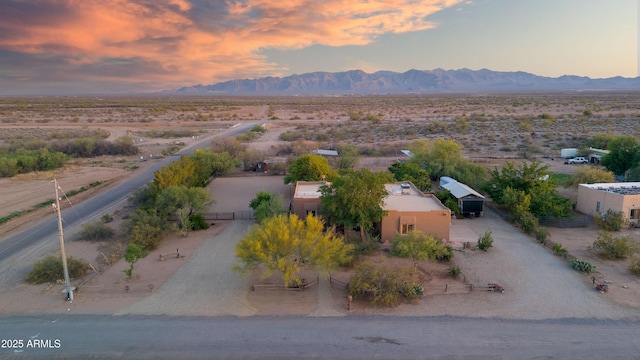 21909 W Beacon Ln, Wittmann, AZ 85361 - aerial view at dusk featuring view of desert, a mountain view, and a rural view