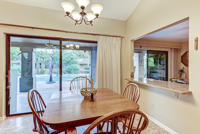 dining area with ceiling fan with notable chandelier and a healthy amount of sunlight