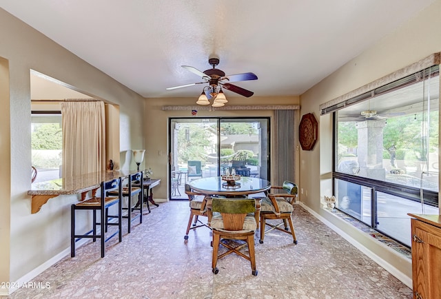 dining room featuring ceiling fan