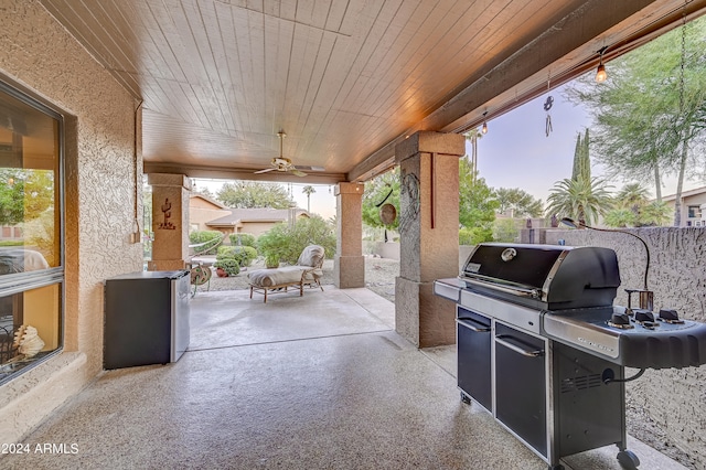 view of patio with grilling area and ceiling fan