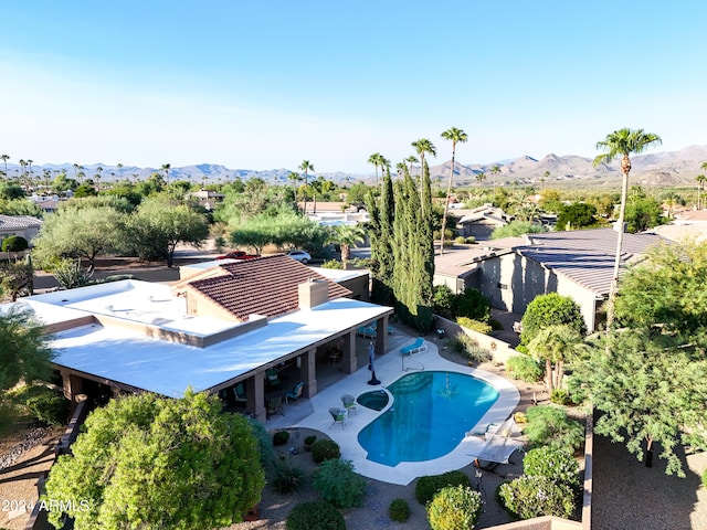 exterior space featuring a mountain view and a patio