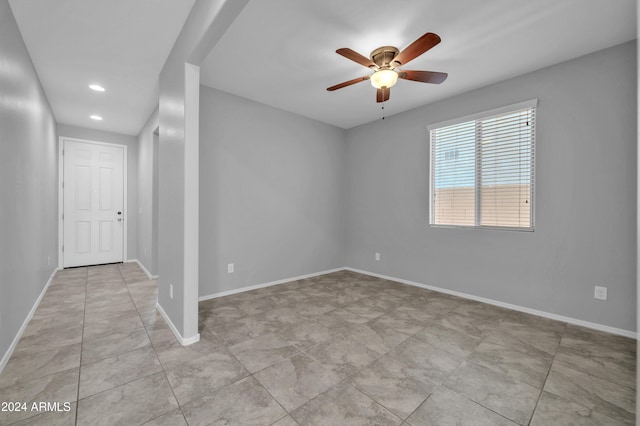 unfurnished room with ceiling fan