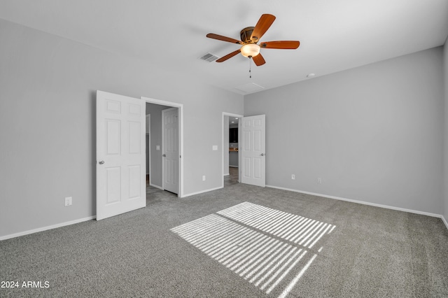 unfurnished bedroom featuring ceiling fan and carpet floors