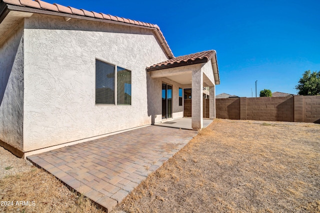 back of property featuring a patio