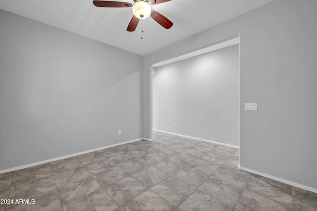 spare room featuring ceiling fan