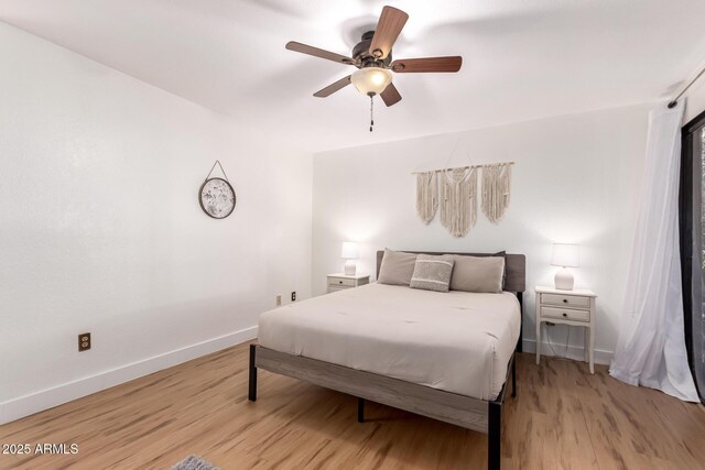 4950 N Miller Rd Unit 200, Scottsdale, AZ 85251 - bedroom with light wood-type flooring, ceiling fan, and baseboards
