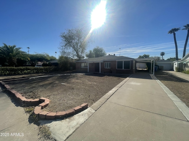 view of front of property featuring a carport