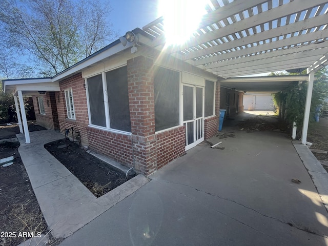 view of side of home featuring a carport