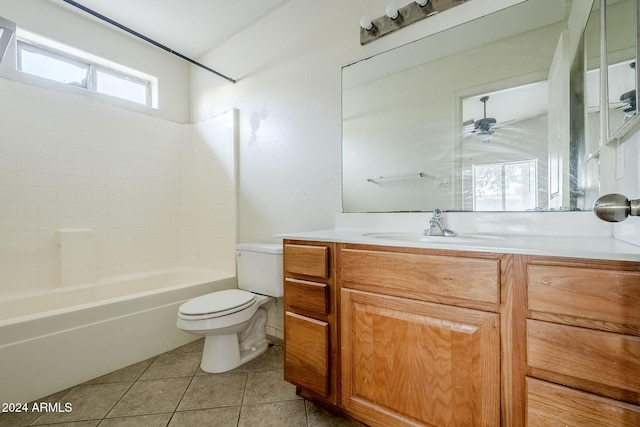 full bathroom featuring ceiling fan, washtub / shower combination, tile patterned floors, toilet, and vanity