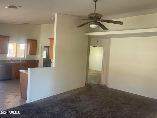 kitchen with dishwasher, ceiling fan, light colored carpet, and sink