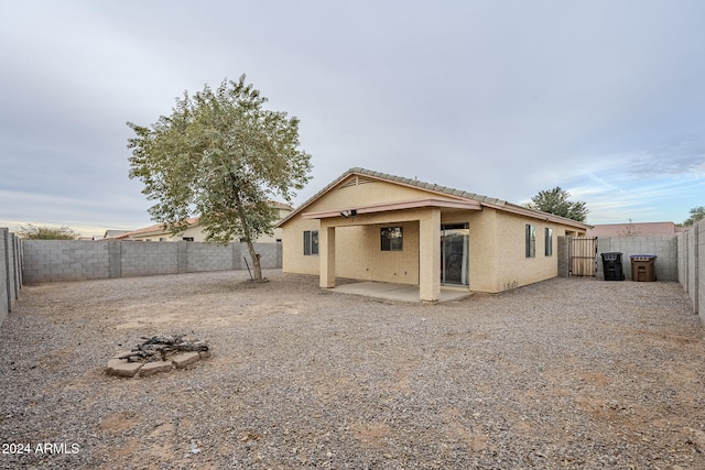 back of house with a patio area