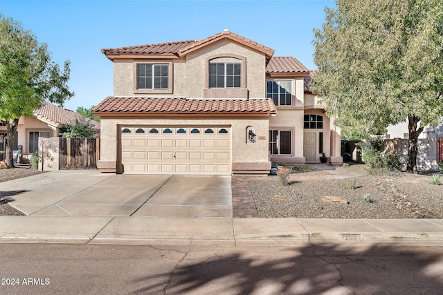 mediterranean / spanish-style house featuring a garage