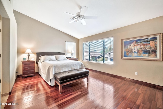 bedroom featuring hardwood / wood-style floors, ceiling fan, and lofted ceiling