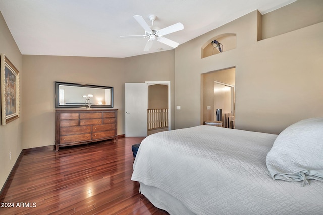 bedroom featuring ceiling fan, lofted ceiling, and dark hardwood / wood-style flooring