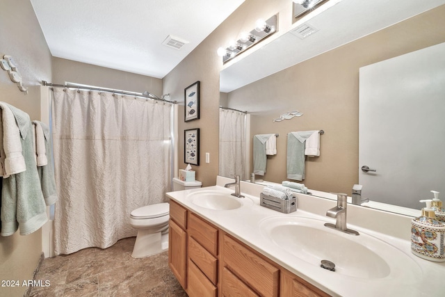 bathroom featuring vanity, a shower with shower curtain, and toilet