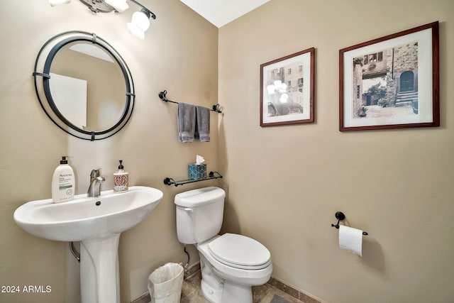 bathroom featuring tile patterned floors and toilet