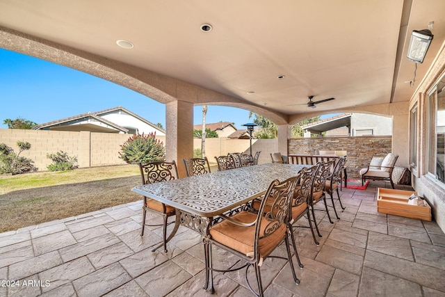 view of patio featuring ceiling fan