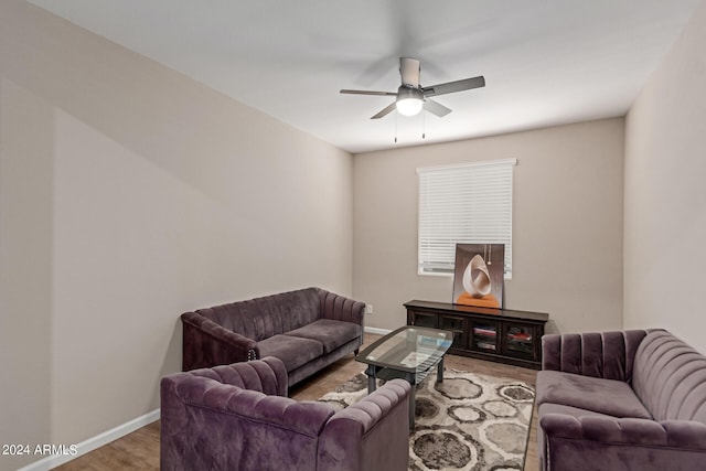 living room with hardwood / wood-style floors and ceiling fan