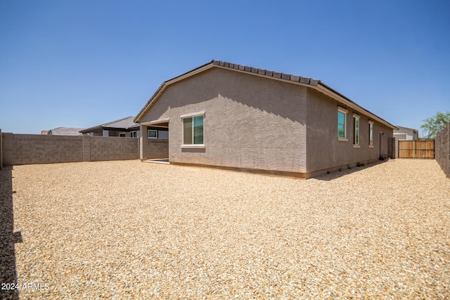 back of house featuring a patio