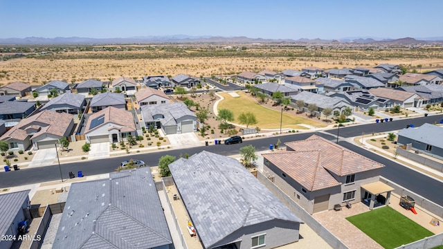 birds eye view of property with a mountain view