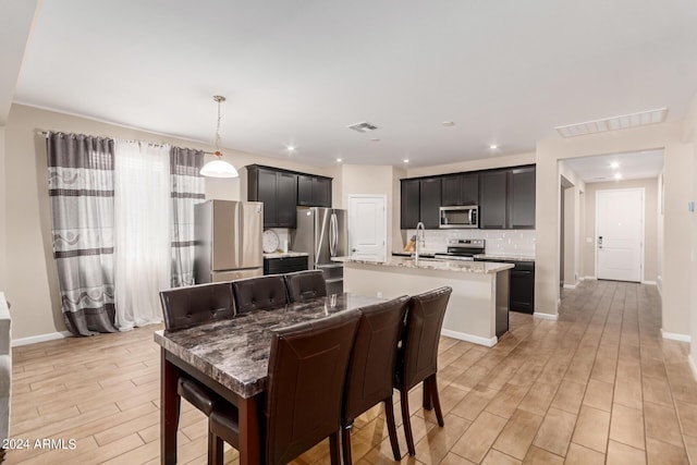 dining room featuring light hardwood / wood-style flooring