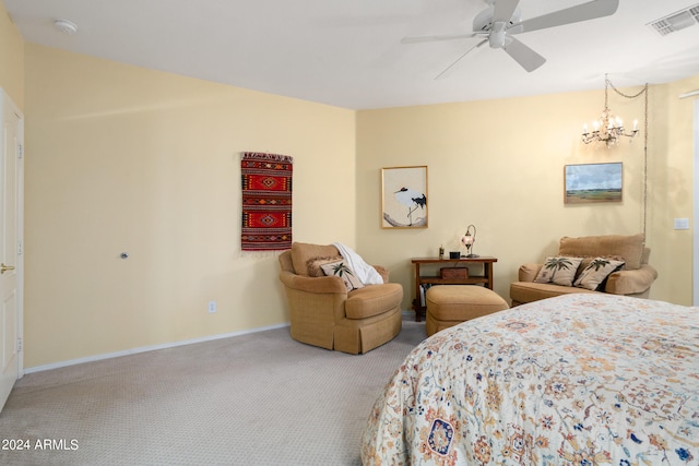 carpeted bedroom with ceiling fan with notable chandelier