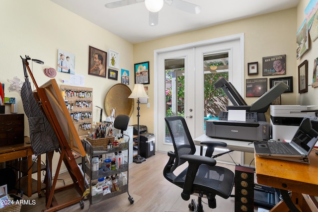 office featuring french doors, ceiling fan, and light wood-type flooring