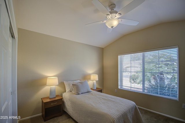 bedroom with ceiling fan, carpet flooring, and vaulted ceiling