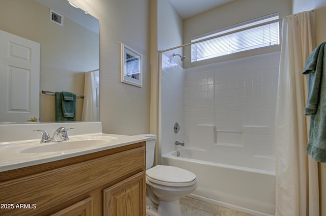 full bathroom featuring vanity, toilet, tile patterned flooring, and shower / bath combo with shower curtain