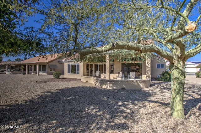 back of property with a patio area