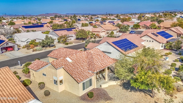 birds eye view of property with a mountain view