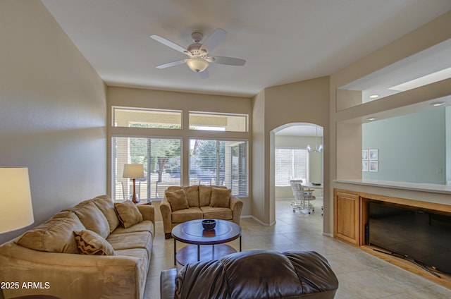 living room featuring light tile patterned floors and ceiling fan